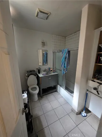 a kitchen with granite countertop a sink and a stove
