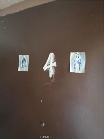 a bedroom with bed and a night stand