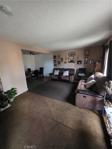 a bathroom with a sink a toilet a mirror and shower