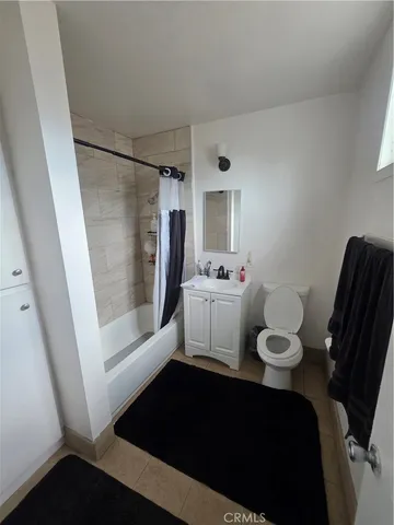 a kitchen with a stove and a refrigerator