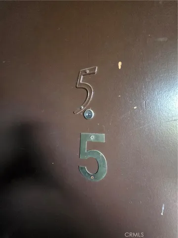 a bedroom with bed and window