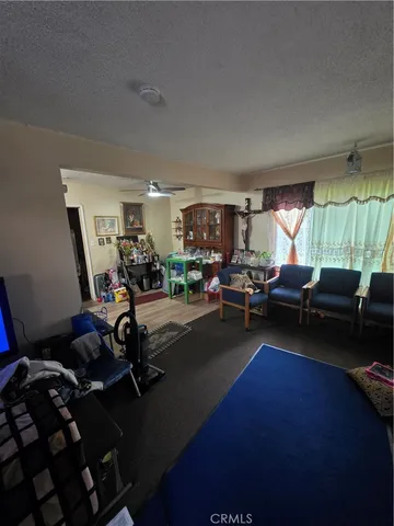 a living room with hard wood floors and a couch