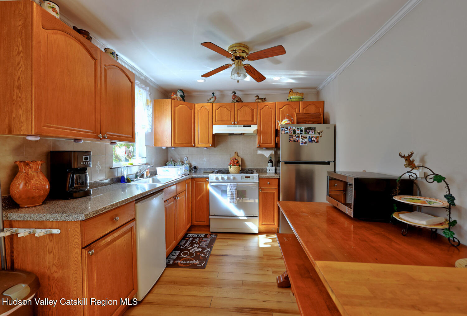 626 Bross Street Cairo, NY 12413 - Photo 20 of 78 a kitchen with granite countertop a refrigerator a sink dishwasher stove and oven with wooden cabinets