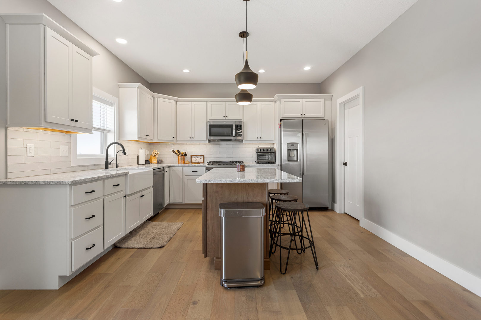 103 Wildflower Heyworth, IL 61745 - Photo 11 of 39 a kitchen with a sink stainless steel appliances and white cabinets