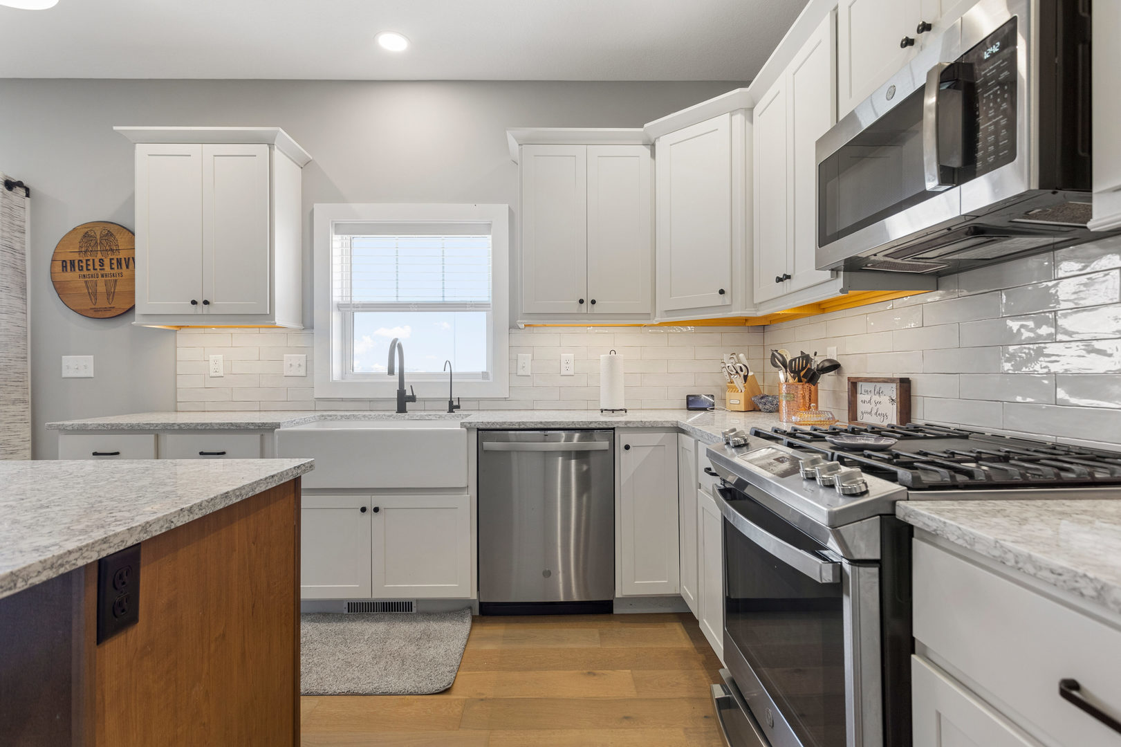 103 Wildflower Heyworth, IL 61745 - Photo 12 of 39 a kitchen with stainless steel appliances granite countertop a stove a sink and a microwave