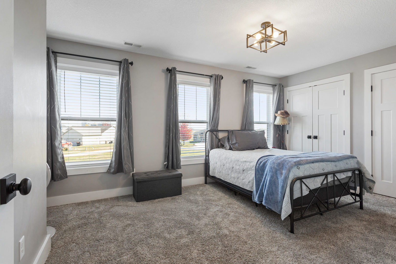 103 Wildflower Heyworth, IL 61745 - Photo 24 of 39 a spacious bedroom with a bed and a window