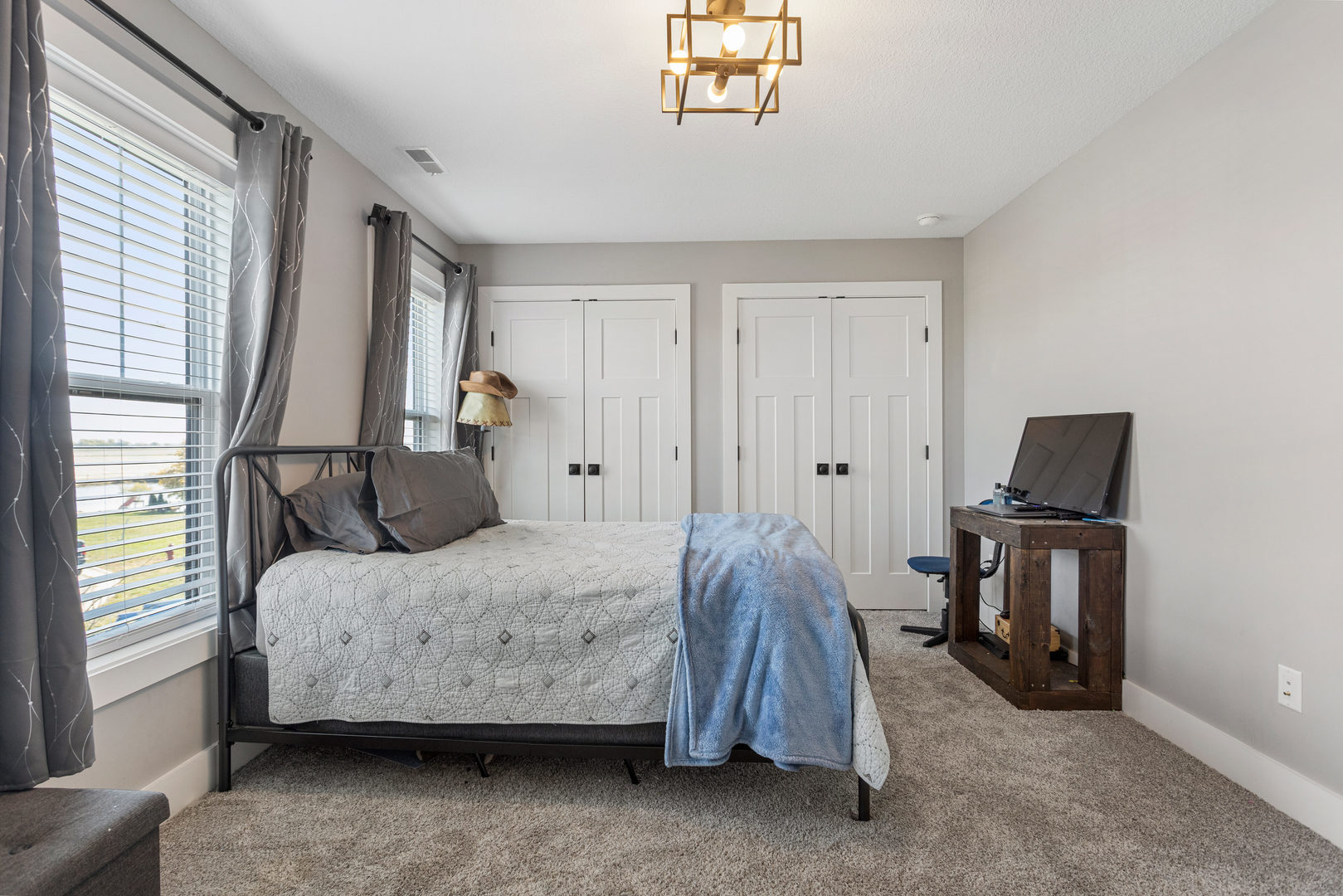 103 Wildflower Heyworth, IL 61745 - Photo 25 of 39 a bedroom with a bed and a tv