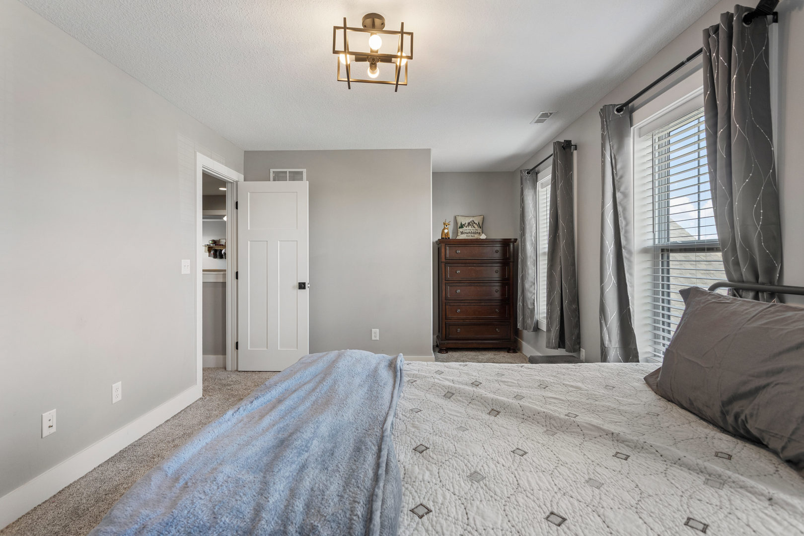 103 Wildflower Heyworth, IL 61745 - Photo 26 of 39 a bedroom with a bed and a window