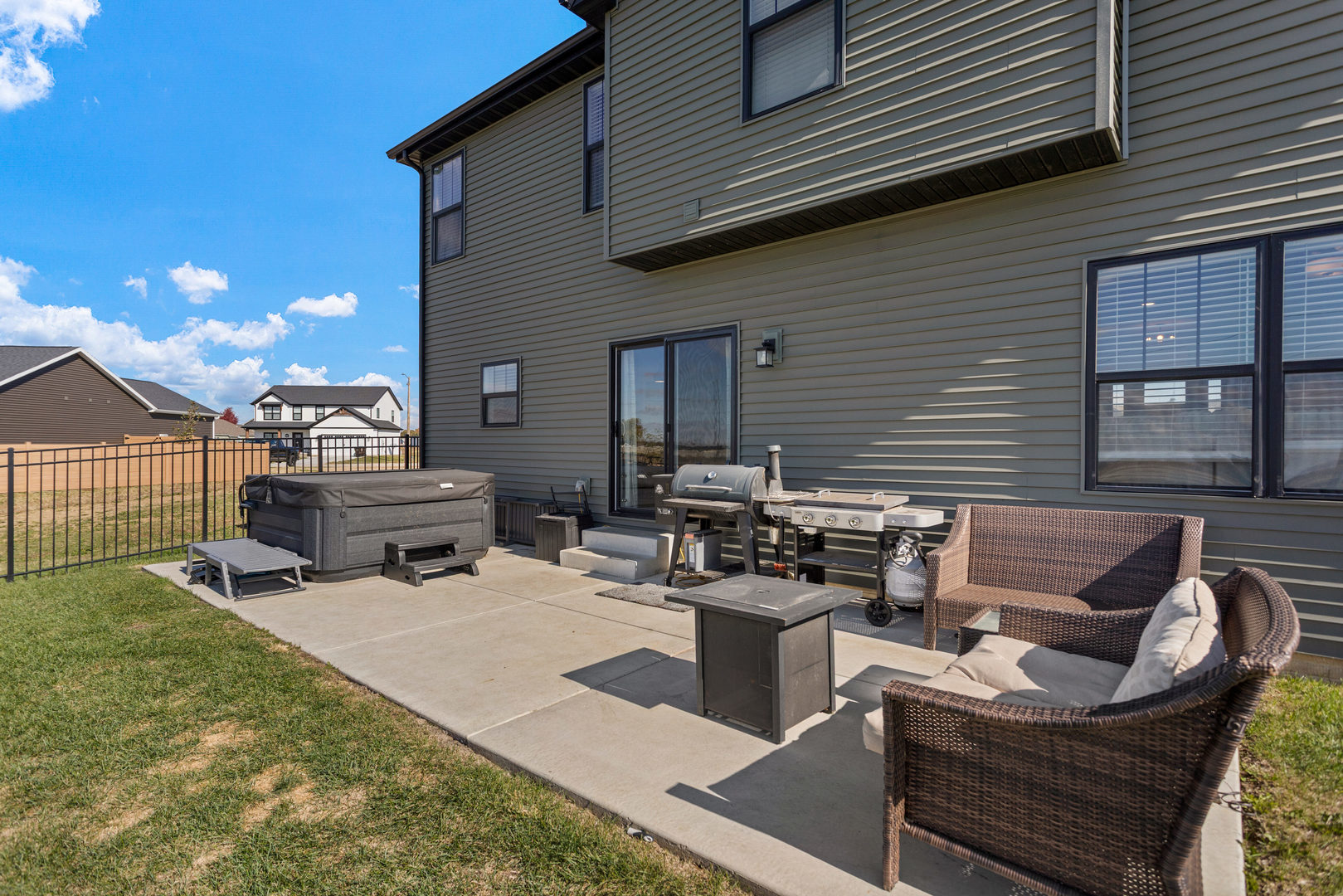 103 Wildflower Heyworth, IL 61745 - Photo 35 of 39 a view of a patio with couches chairs and a fire pit