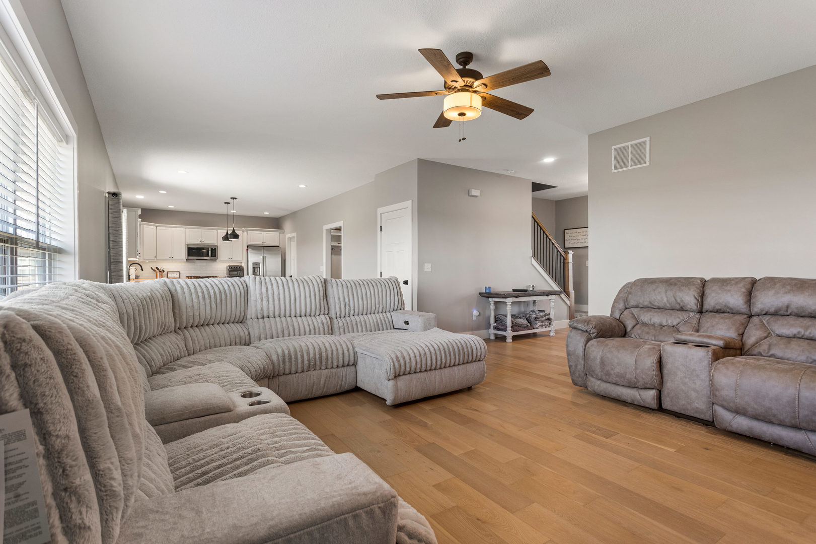 103 Wildflower Heyworth, IL 61745 - Photo 8 of 39 a living room with furniture and a ceiling fan
