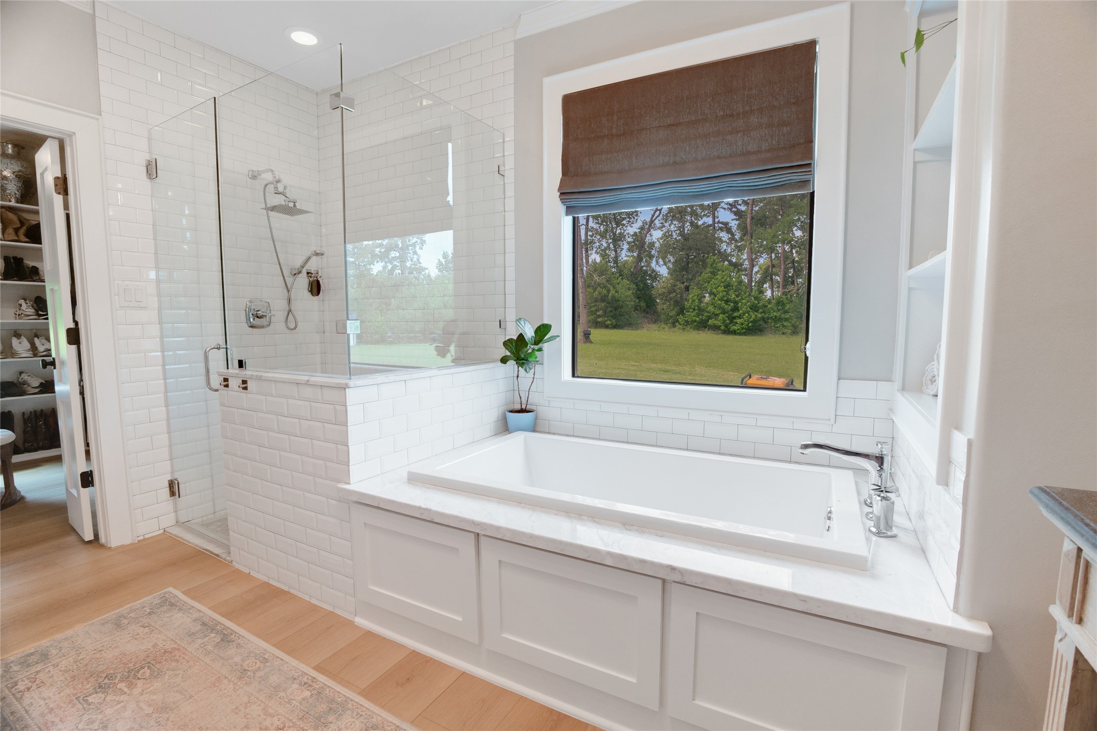 40499 Community Road Magnolia, TX 77354 - Photo 16 of 33 a bathroom with a bathtub and a shower