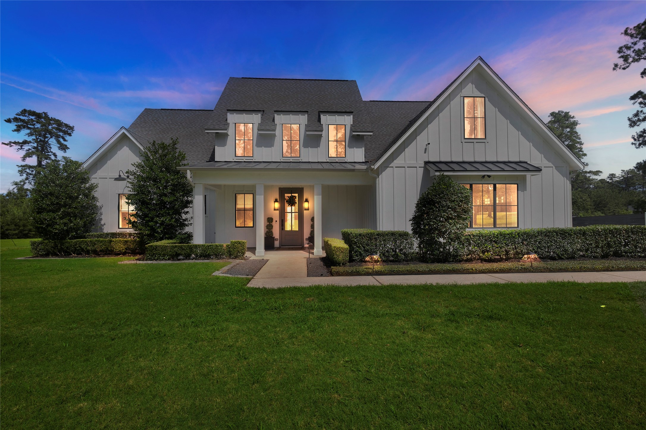 40499 Community Road Magnolia, TX 77354 - Photo 2 of 33 a front view of a house with a yard