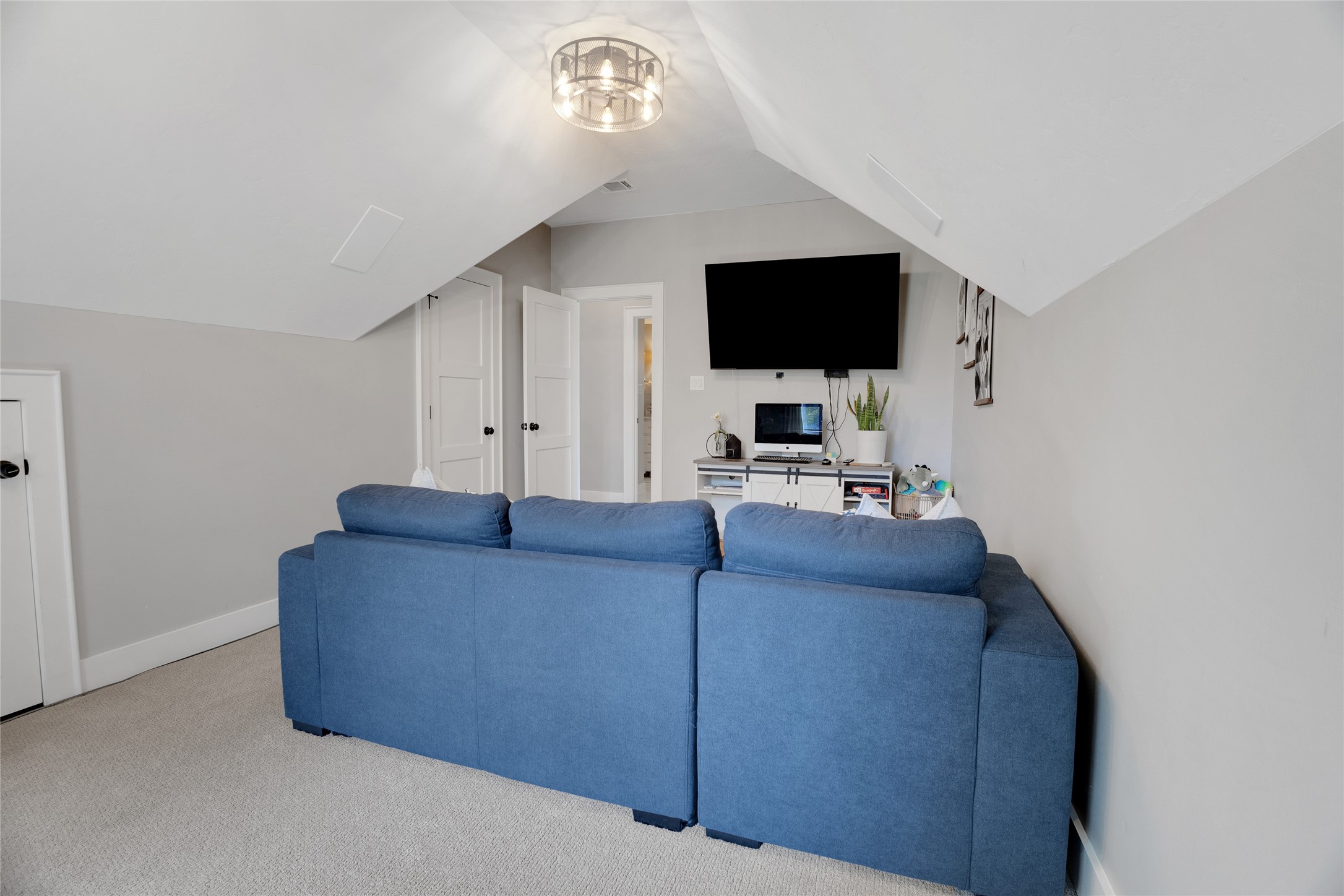 40499 Community Road Magnolia, TX 77354 - Photo 27 of 33 a living room with furniture and a flat screen tv
