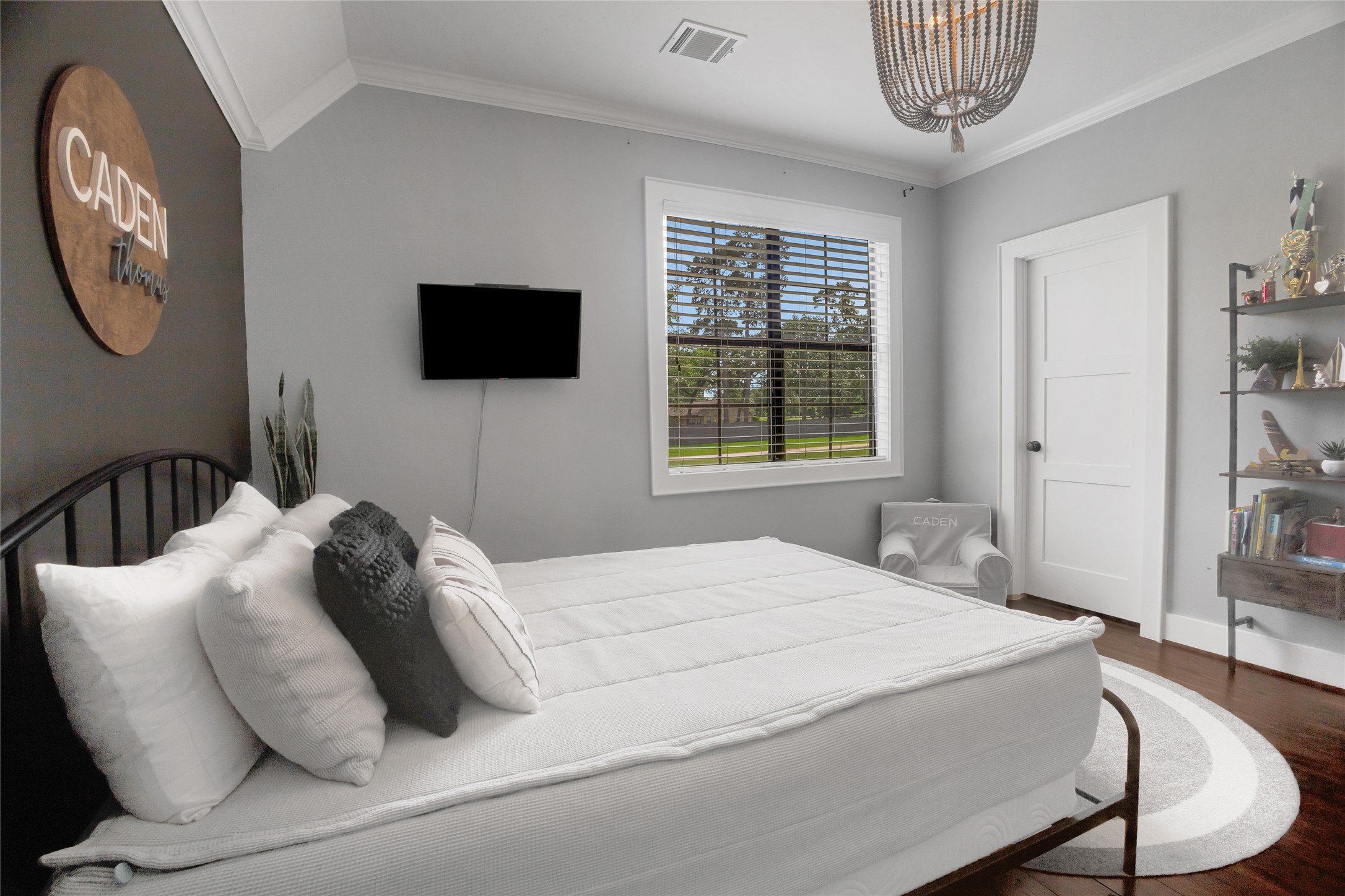 40499 Community Road Magnolia, TX 77354 - Photo 29 of 33 a bedroom with a bed a mirror and a window