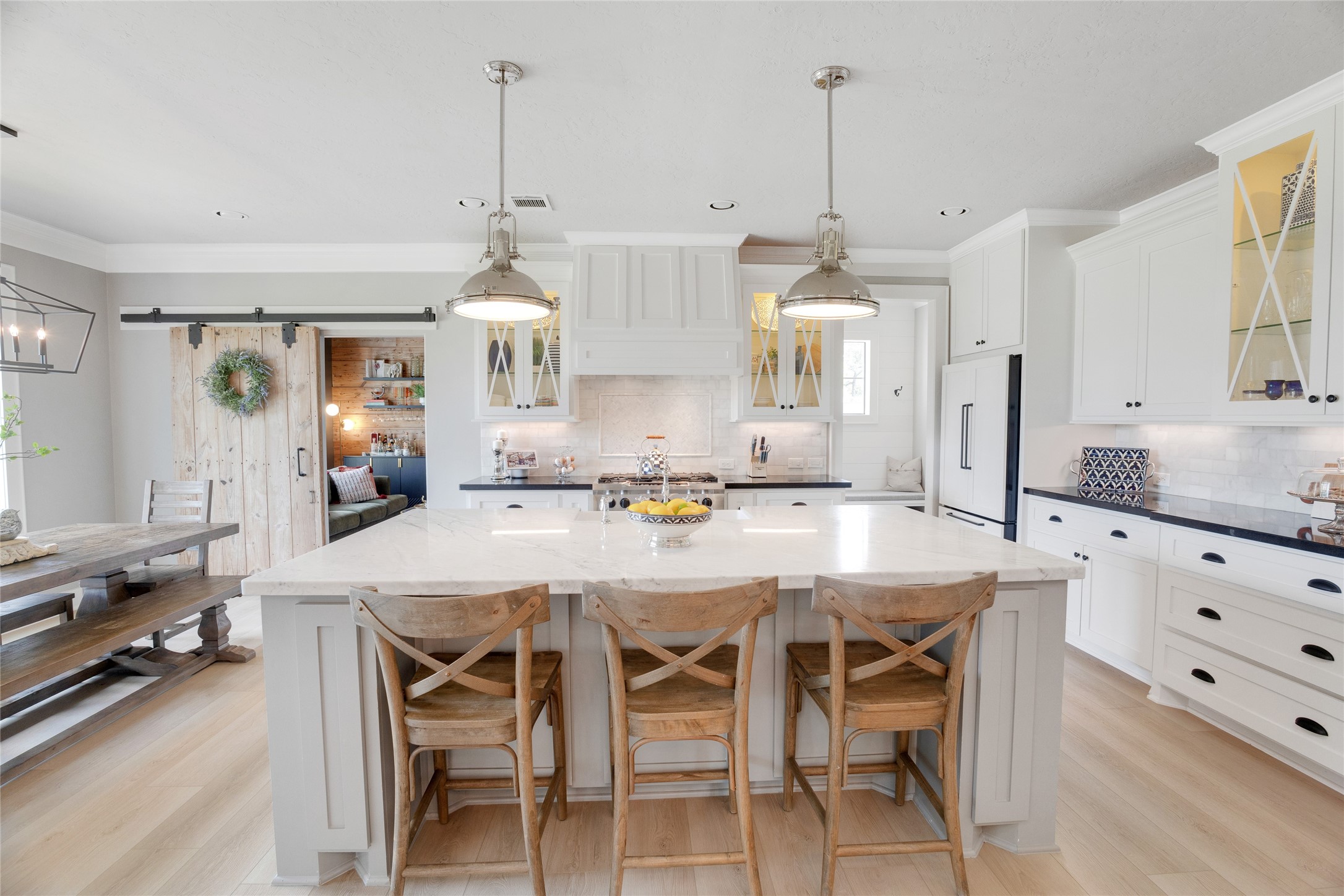 40499 Community Road Magnolia, TX 77354 - Photo 6 of 33 a dining table chair wooden floor and a chandelier