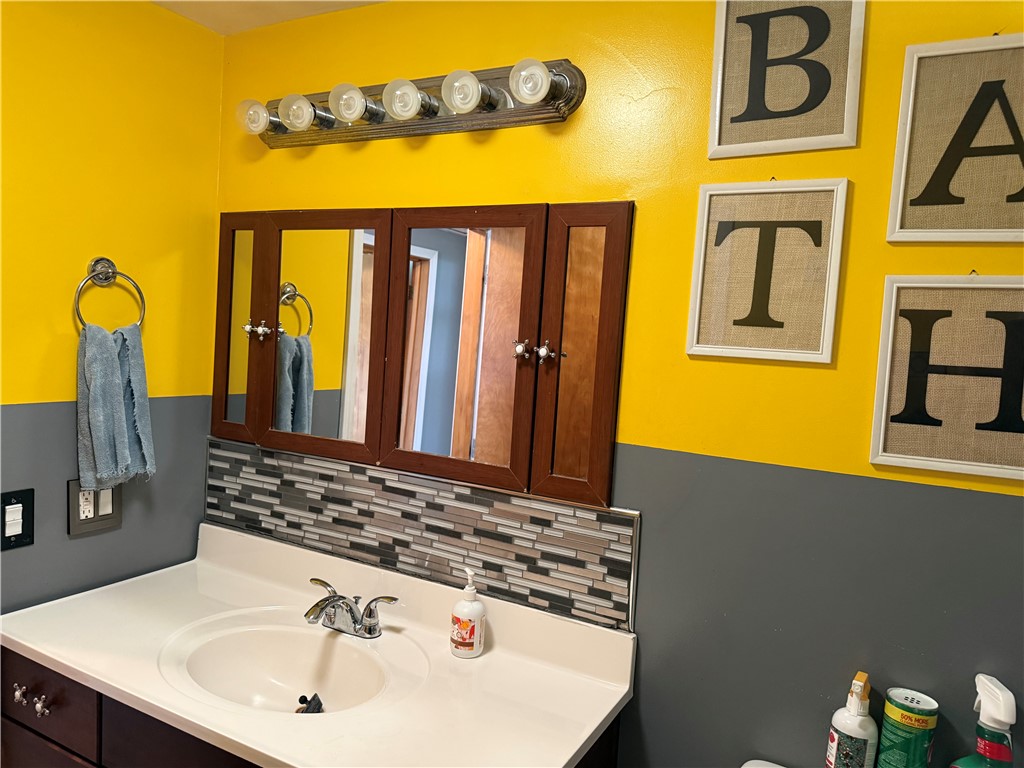 4732 Lehigh Drive Springfield, OH 45503 - Photo 9 of 27 This vibrant bathroom features a functional vanity and unique tile accents.