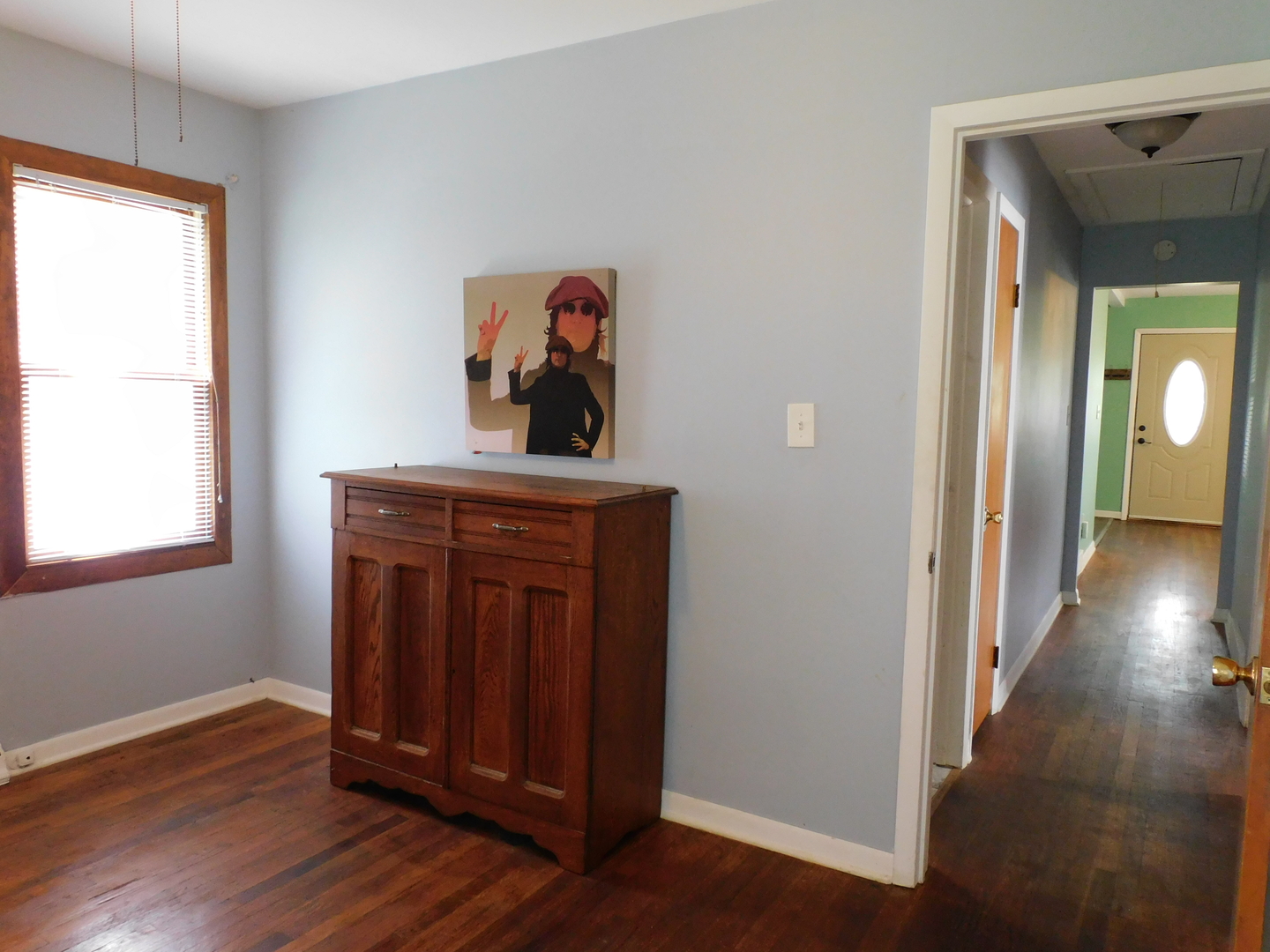 1419 Main Street Spring Grove, IL 60081 - Photo 11 of 27 a view of a livingroom with wooden floor and a window