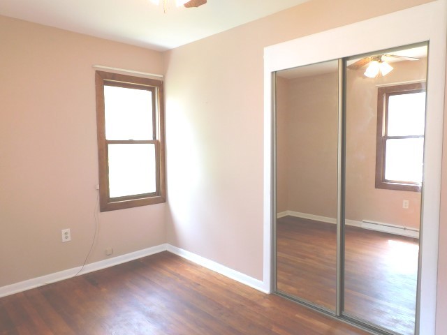 1419 Main Street Spring Grove, IL 60081 - Photo 13 of 27 an empty room with wooden floor and a window