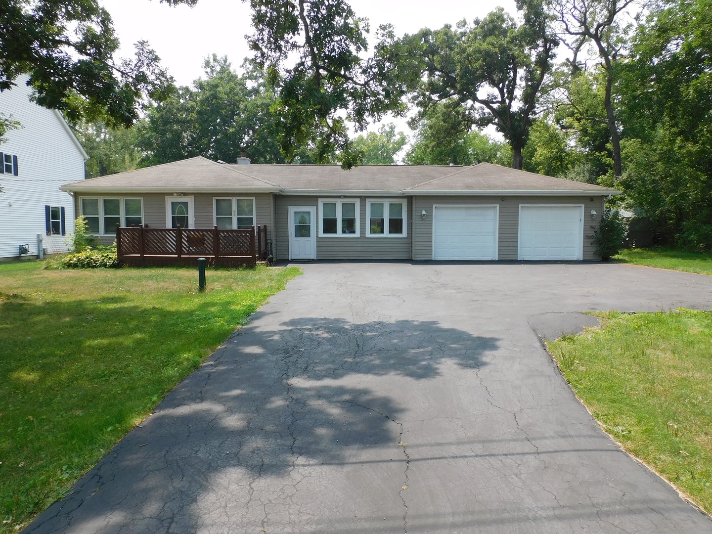 1419 Main Street Spring Grove, IL 60081 - Photo 2 of 27 a front view of a house with garden