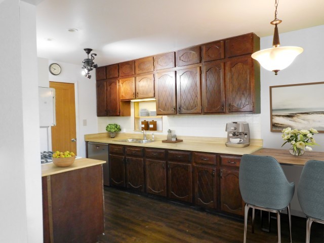 1419 Main Street Spring Grove, IL 60081 - Photo 5 of 27 a kitchen with granite countertop a sink cabinets and window