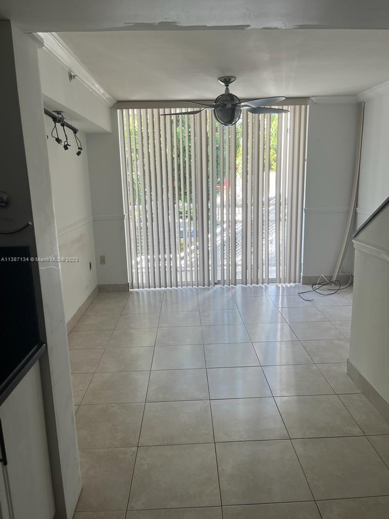 450 Southwest 3rd Street, Unit 4 Miami, FL 33130 - Photo 5 of 10 a view of an empty room with a window