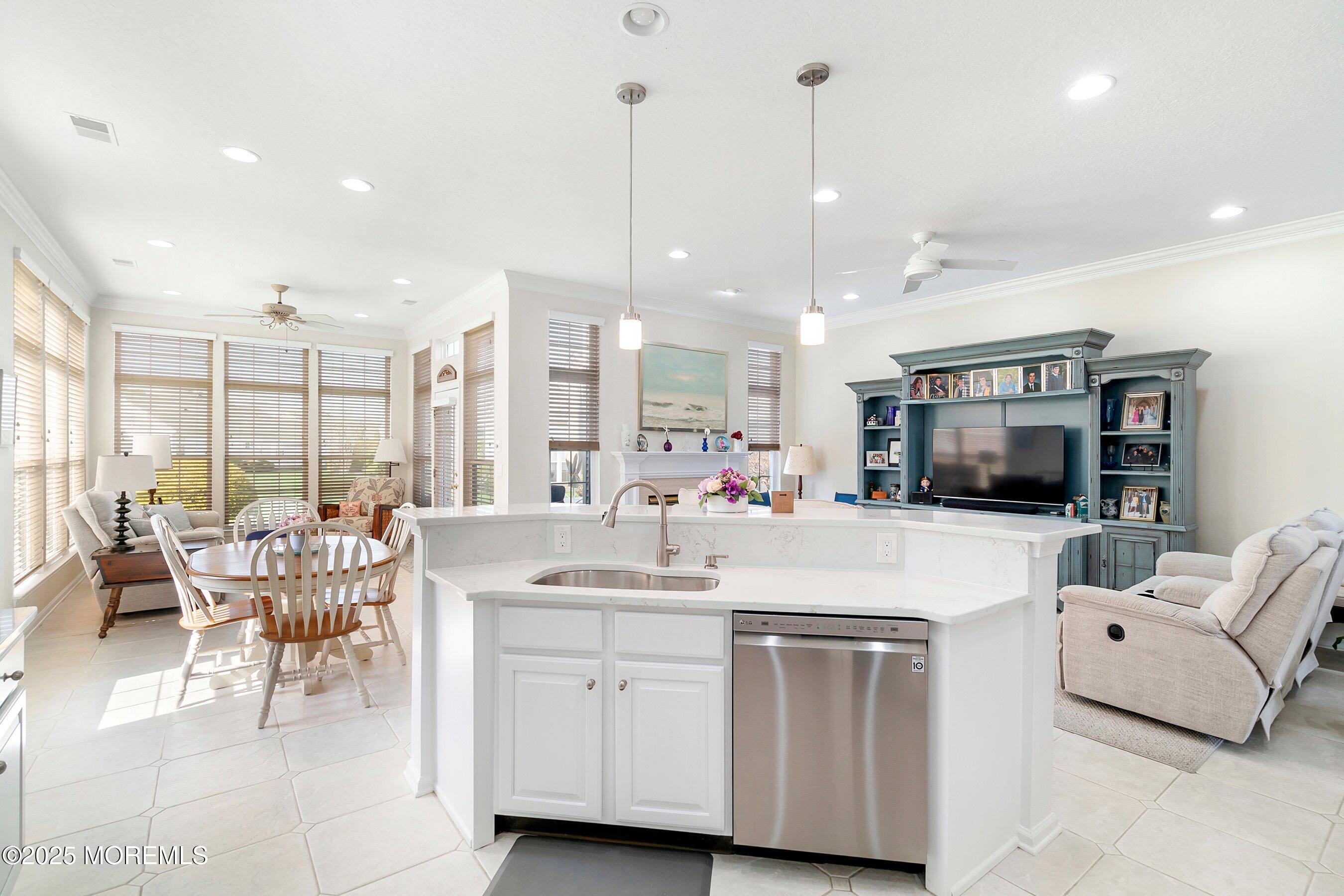 1518 Rabbit Run Manasquan, NJ 08736 - Photo 15 of 54 a kitchen with stainless steel appliances kitchen island granite countertop a sink and a refrigerator