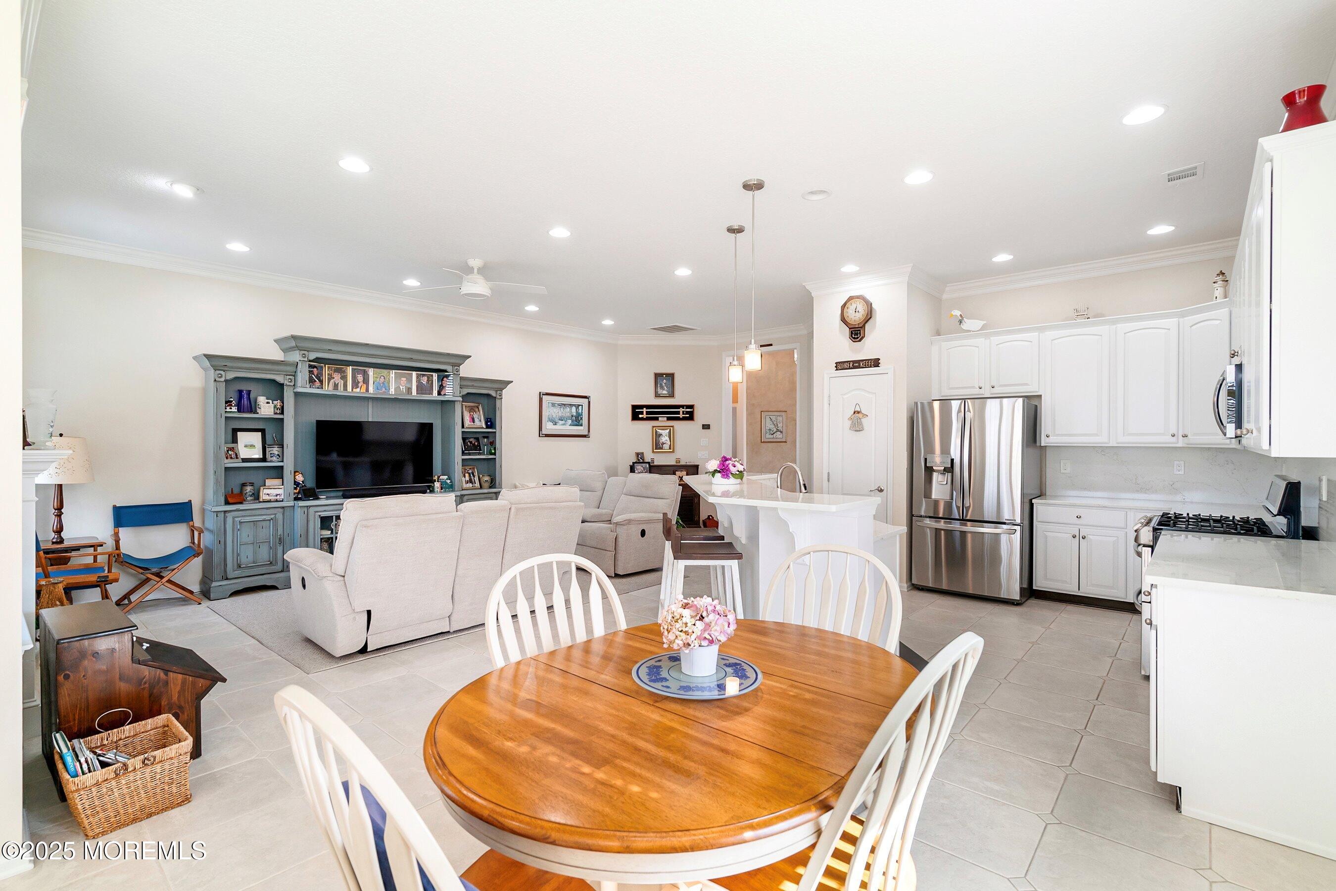 1518 Rabbit Run Manasquan, NJ 08736 - Photo 19 of 54 a living room with stainless steel appliances furniture a dining table and kitchen view