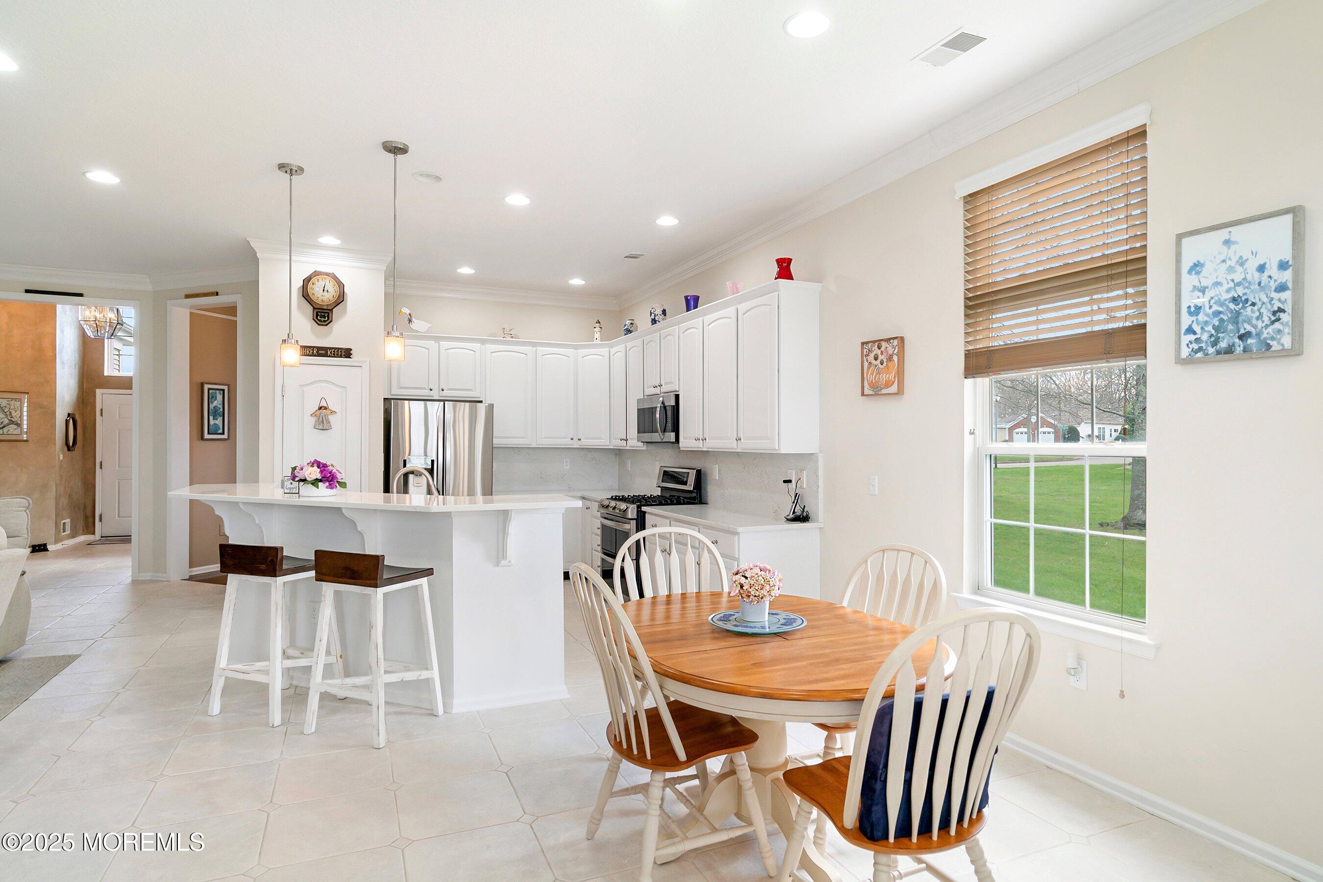 1518 Rabbit Run Manasquan, NJ 08736 - Photo 20 of 54 a view of a dining room with furniture window and outside view