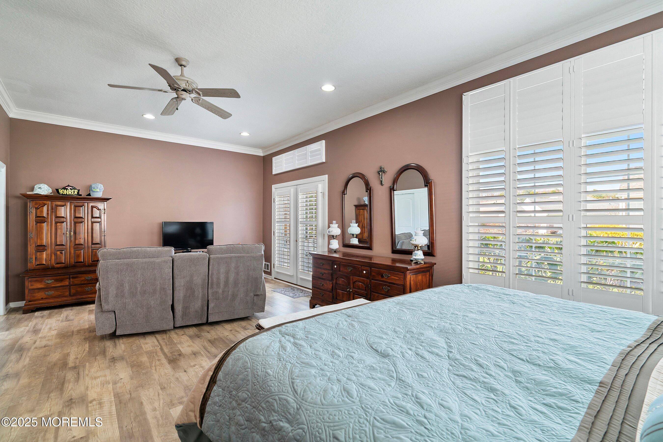 1518 Rabbit Run Manasquan, NJ 08736 - Photo 24 of 54 a bedroom with a large bed and a dresser
