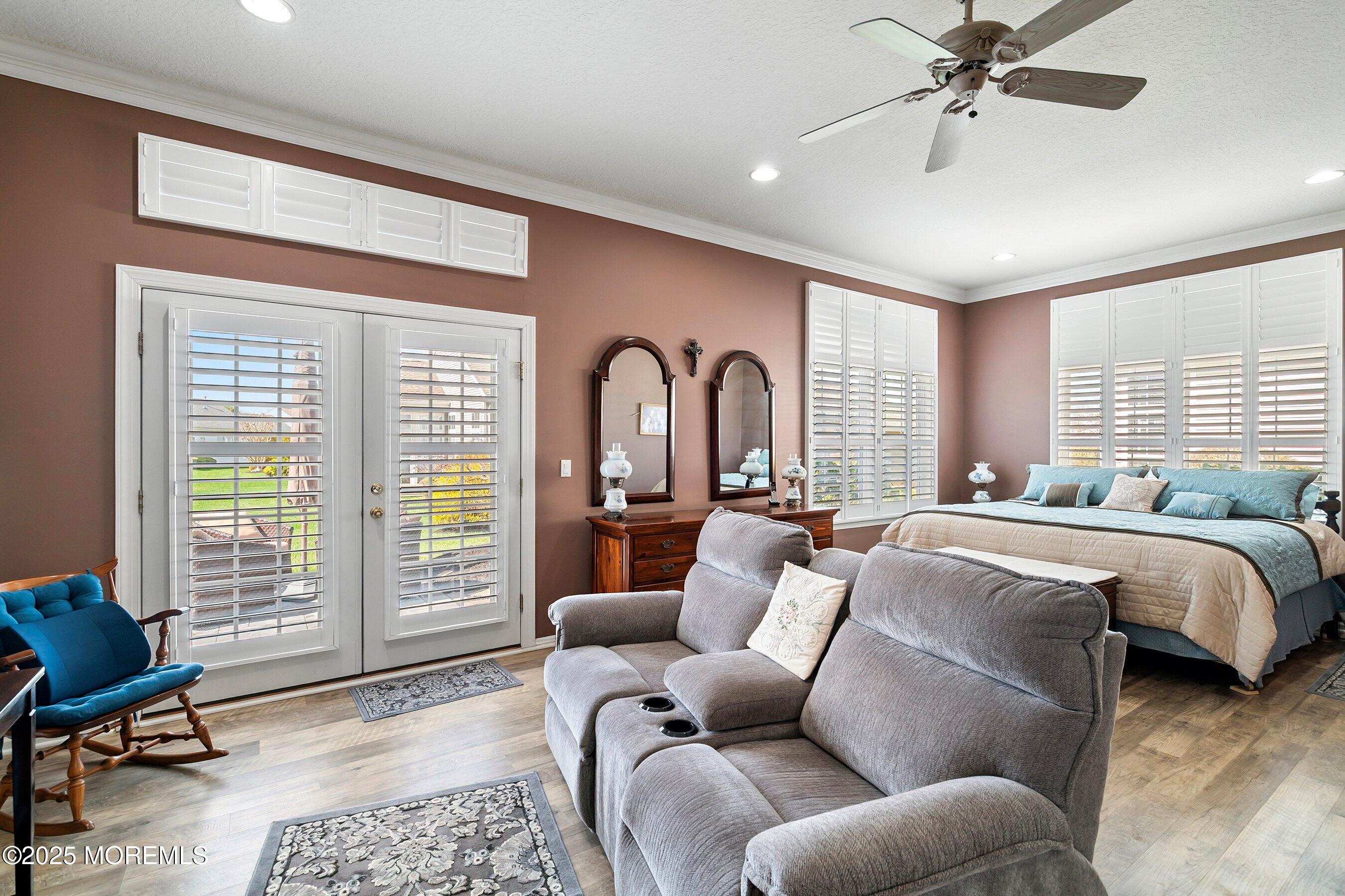1518 Rabbit Run Manasquan, NJ 08736 - Photo 25 of 54 a living room with a balcony a bed furniture and a window