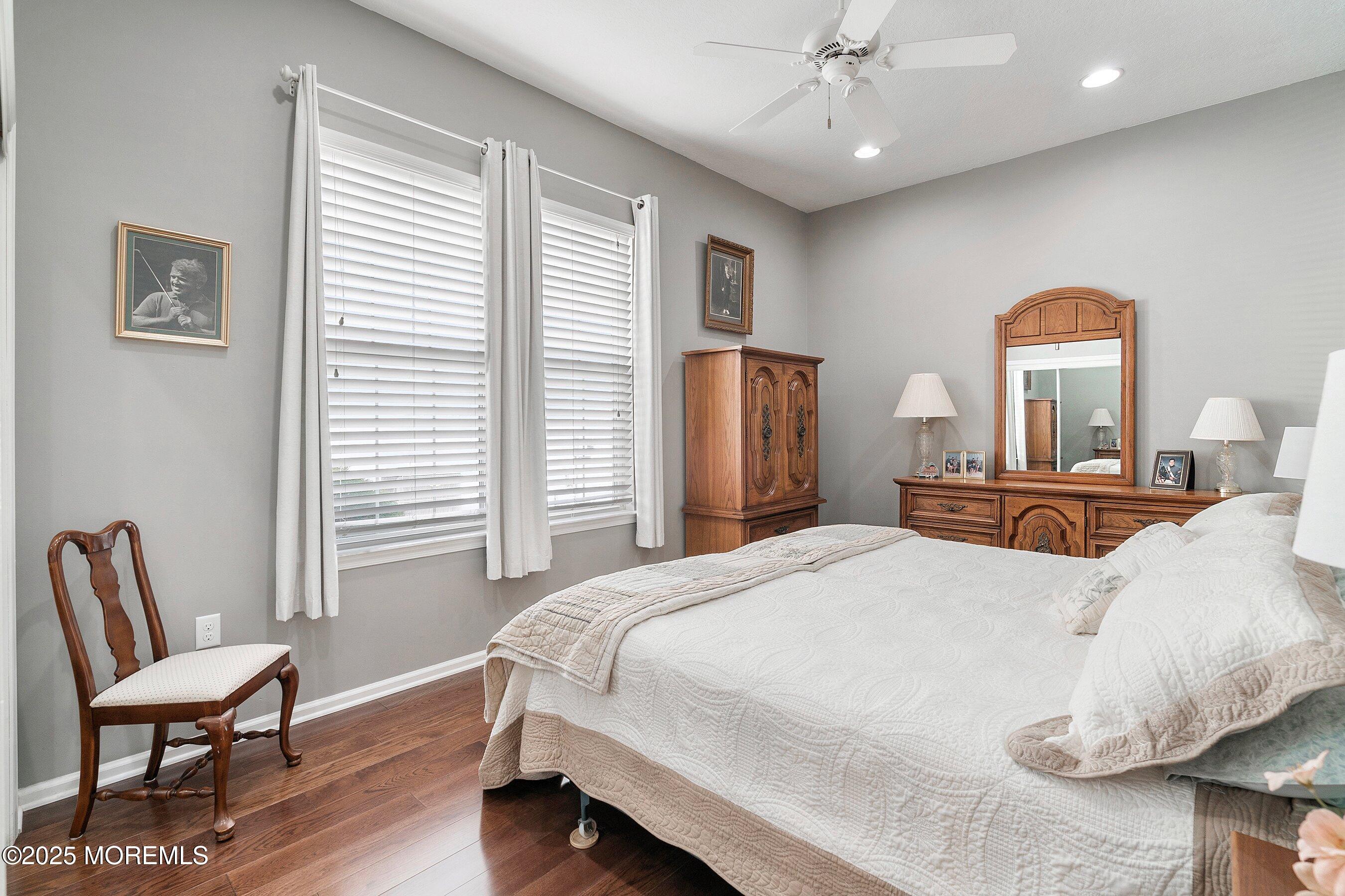 1518 Rabbit Run Manasquan, NJ 08736 - Photo 30 of 54 a bedroom with a bed and a chair