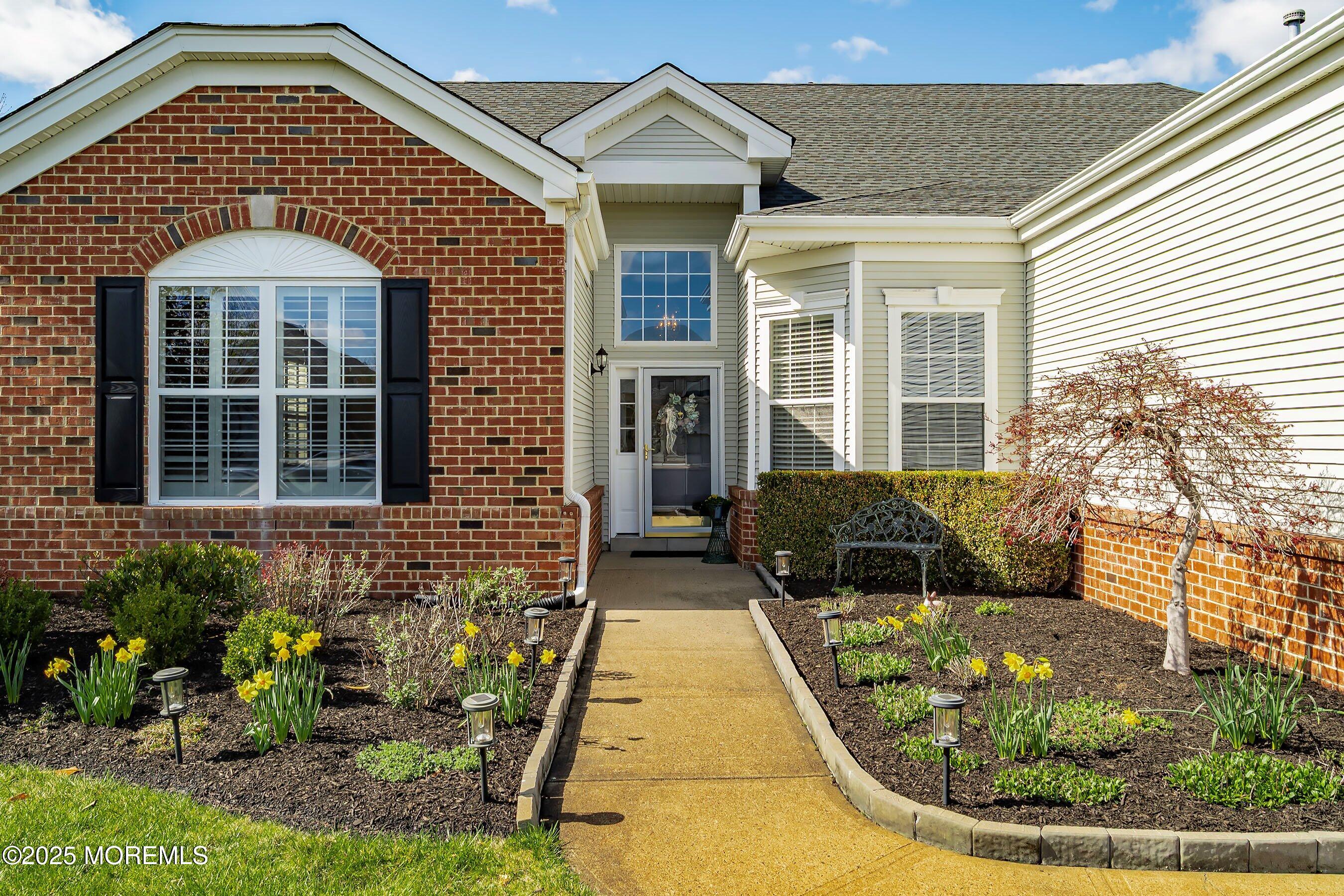 1518 Rabbit Run Manasquan, NJ 08736 - Photo 3 of 54 a front view of a house with entertaining space