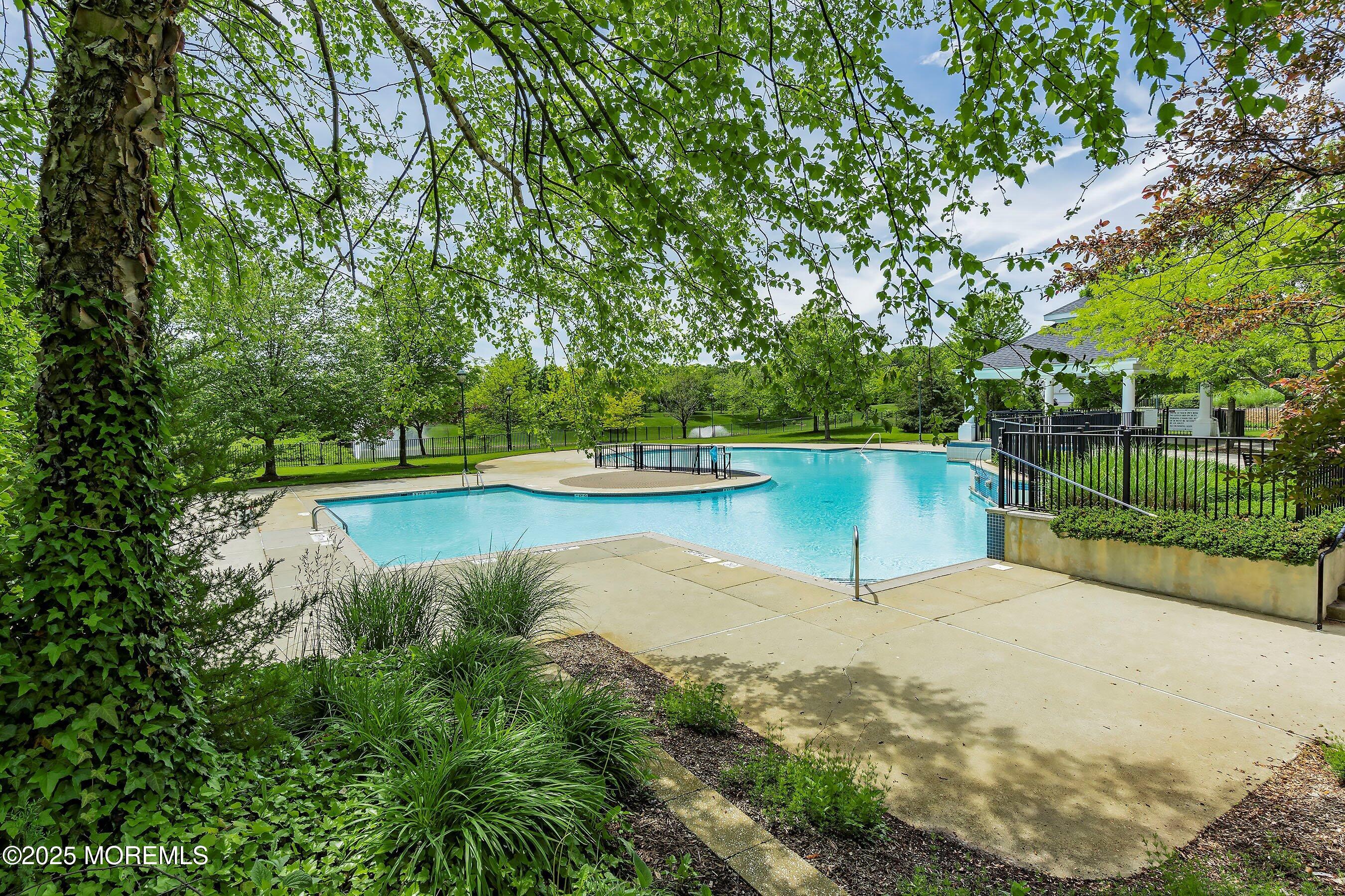 1518 Rabbit Run Manasquan, NJ 08736 - Photo 45 of 54 a view of a lake with a house in the background