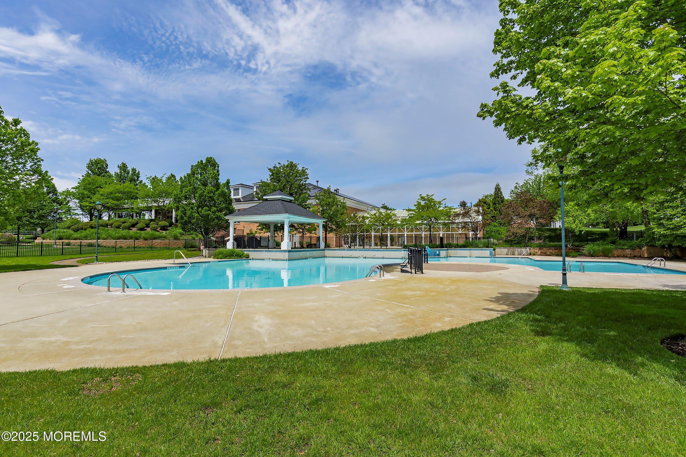 1518 Rabbit Run Manasquan, NJ 08736 - Photo 46 of 54 a view of a swimming pool and a yard
