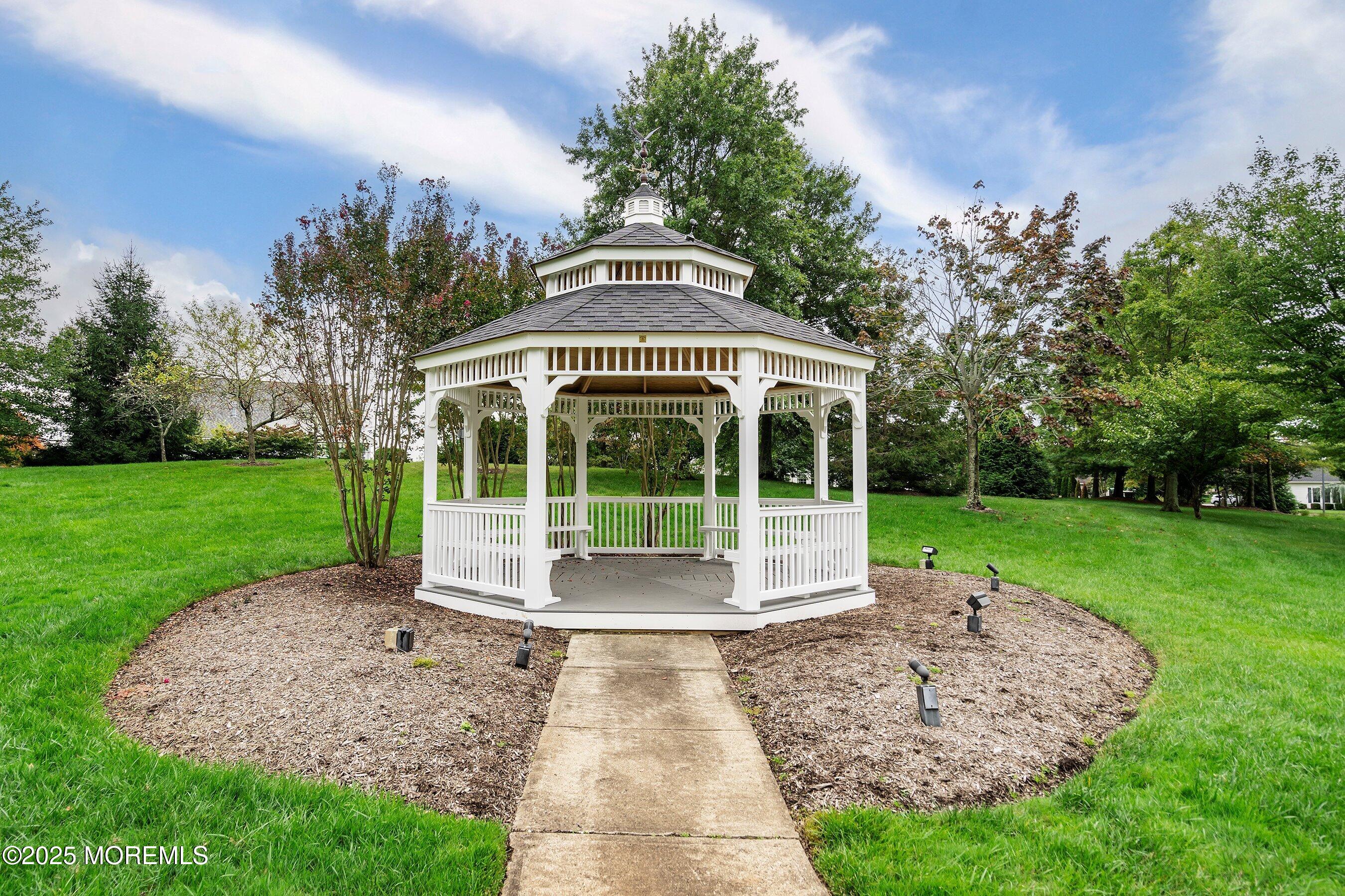 1518 Rabbit Run Manasquan, NJ 08736 - Photo 48 of 54 a view of a house with a yard
