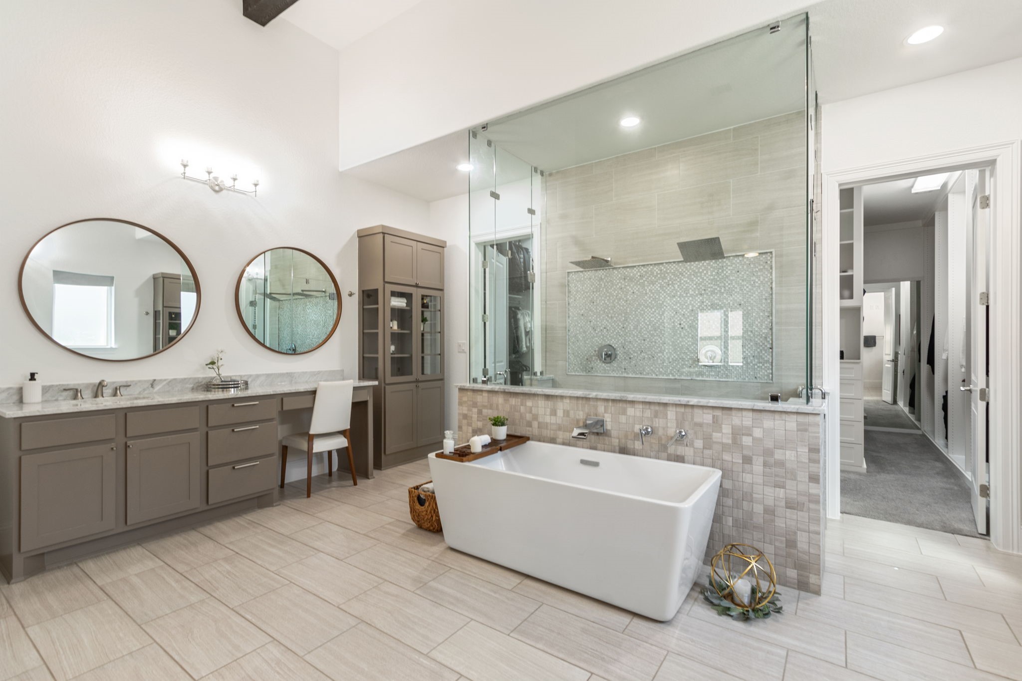 28518 Hoffman Spring Lane Fulshear, TX 77441 - Photo 22 of 50 Gorgeous spa-inspired primary bathroom with dual showers, soaking tub, double vanity areas and doors to huge walk in closet.