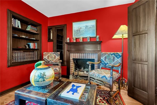 a bedroom with a bed and a fireplace