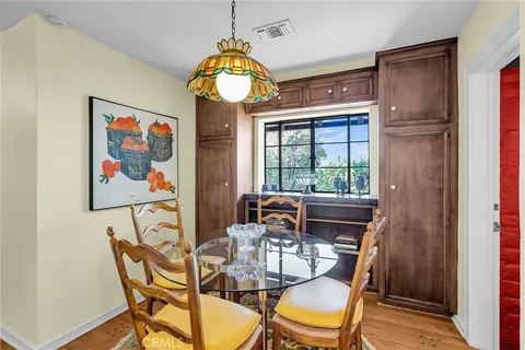 a view of a patio with table and chairs and potted plants