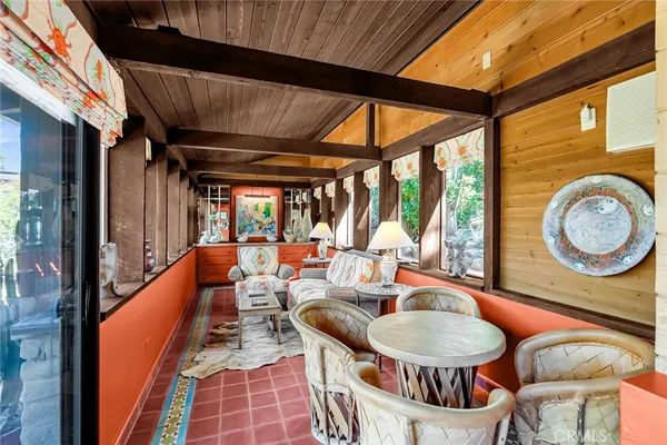 a view of backyard with outdoor seating and green space