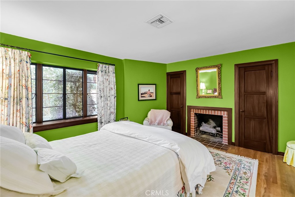 6146 Hawarden Drive Riverside, CA 92506 - Photo 33 of 75 a bedroom with a bed and a fireplace