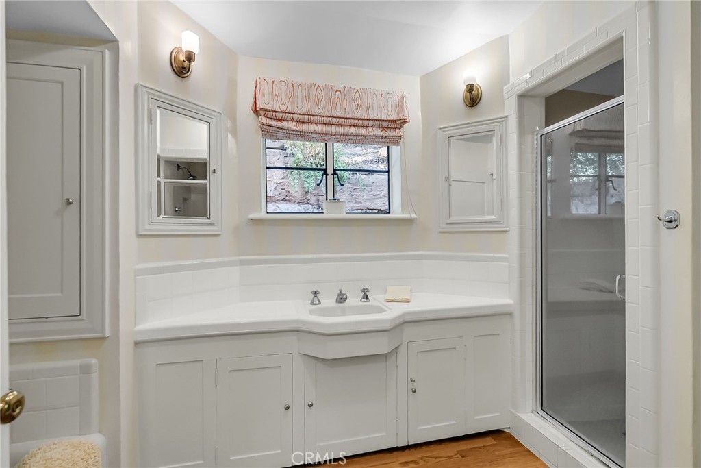 6146 Hawarden Drive Riverside, CA 92506 - Photo 40 of 75 a bathroom with a sink and a mirror