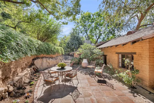 an aerial view of a house with a yard and garden