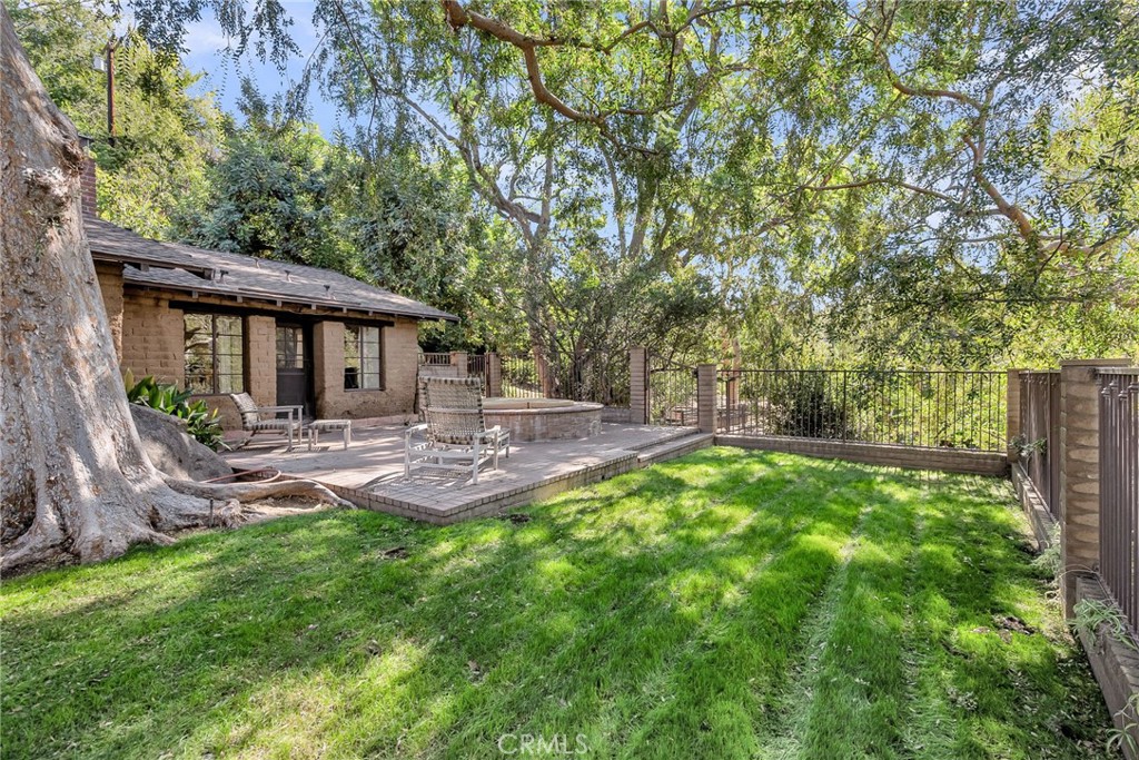 6146 Hawarden Drive Riverside, CA 92506 - Photo 51 of 75 a view of a house with a backyard and a tree