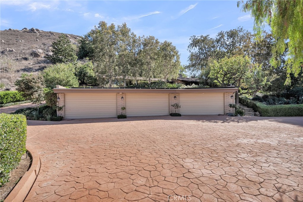 6146 Hawarden Drive Riverside, CA 92506 - Photo 6 of 75 a front view of house with a yard and trees