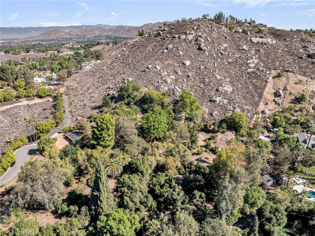 6146 Hawarden Drive Riverside, CA 92506 - Photo 68 of 75 a view of a houses with a lush green hillside