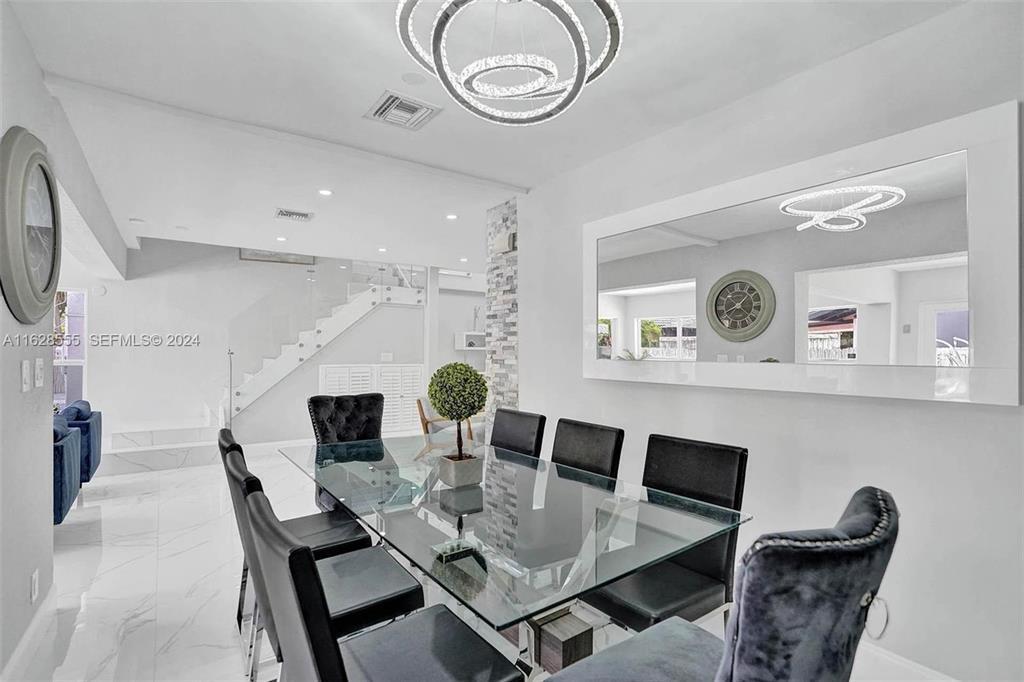 3421 Dover Road Pompano Beach, FL 33062 - Photo 8 of 22 a view of a dining room with furniture and wooden floor