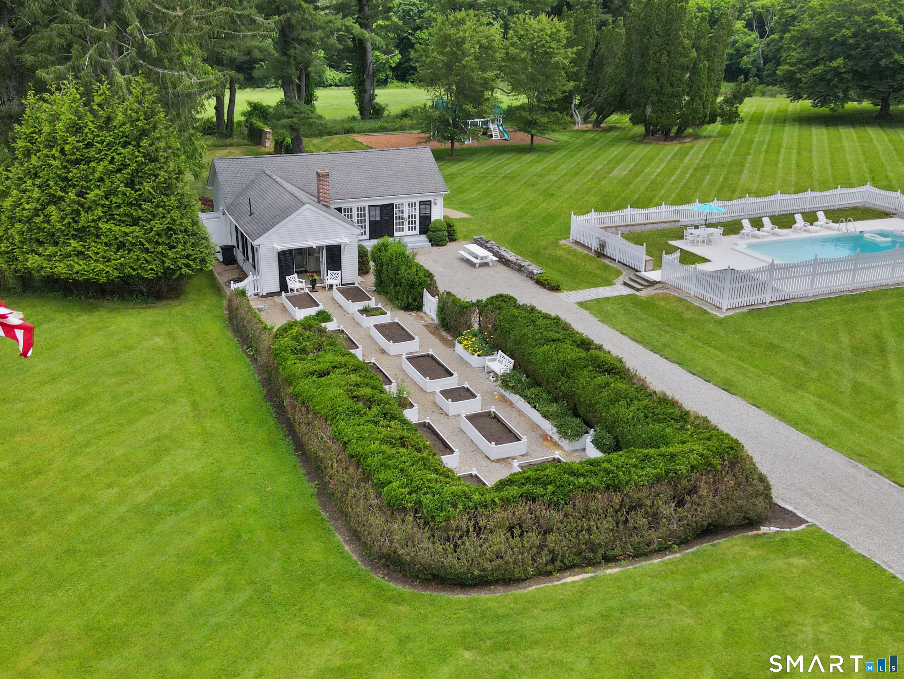 433 Wrights Crossing Road Pomfret Center, CT 06259 - Photo 29 of 40 View of the Pool Cottage with delightful raised beds for plantings and an inground pool