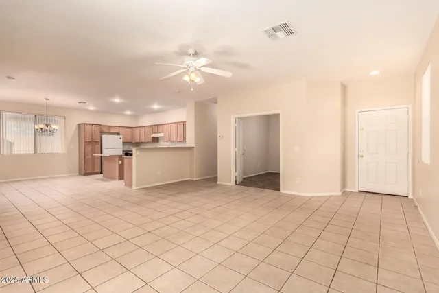 a view of a kitchen with a sink and a refrigerator