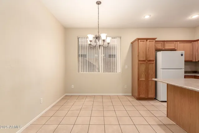 a view of a kitchen with a dishwasher and a refrigerator