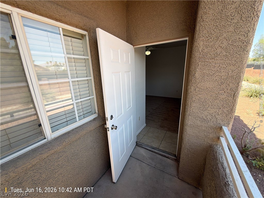4730 East Craig Road, Unit 1124 Las Vegas, NV 89115 - Photo 19 of 22 An inviting entryway leads into this desert-style residence with a tiled floor.